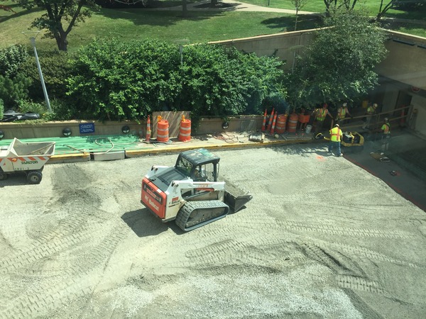 Tarlton team moves gravel at the BJC Plaza Garage