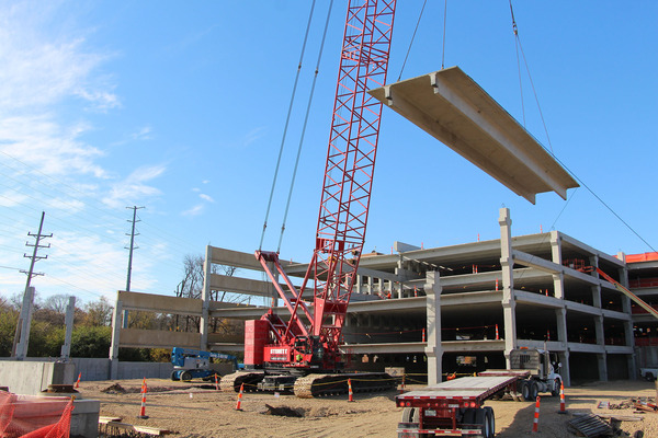 A crane lifts part of the Webster Garden Avenue garage