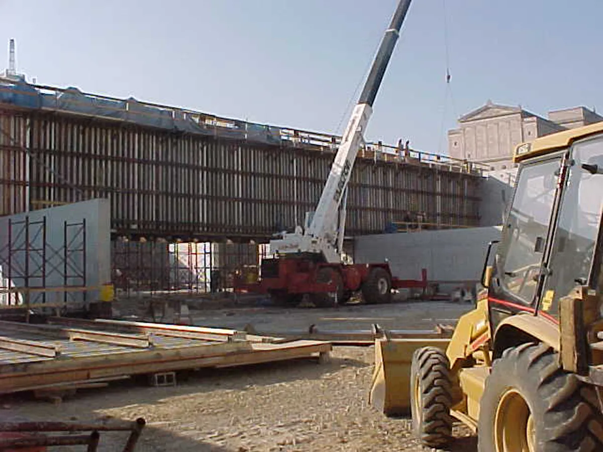 Steel structural framework and crane at an active construction site