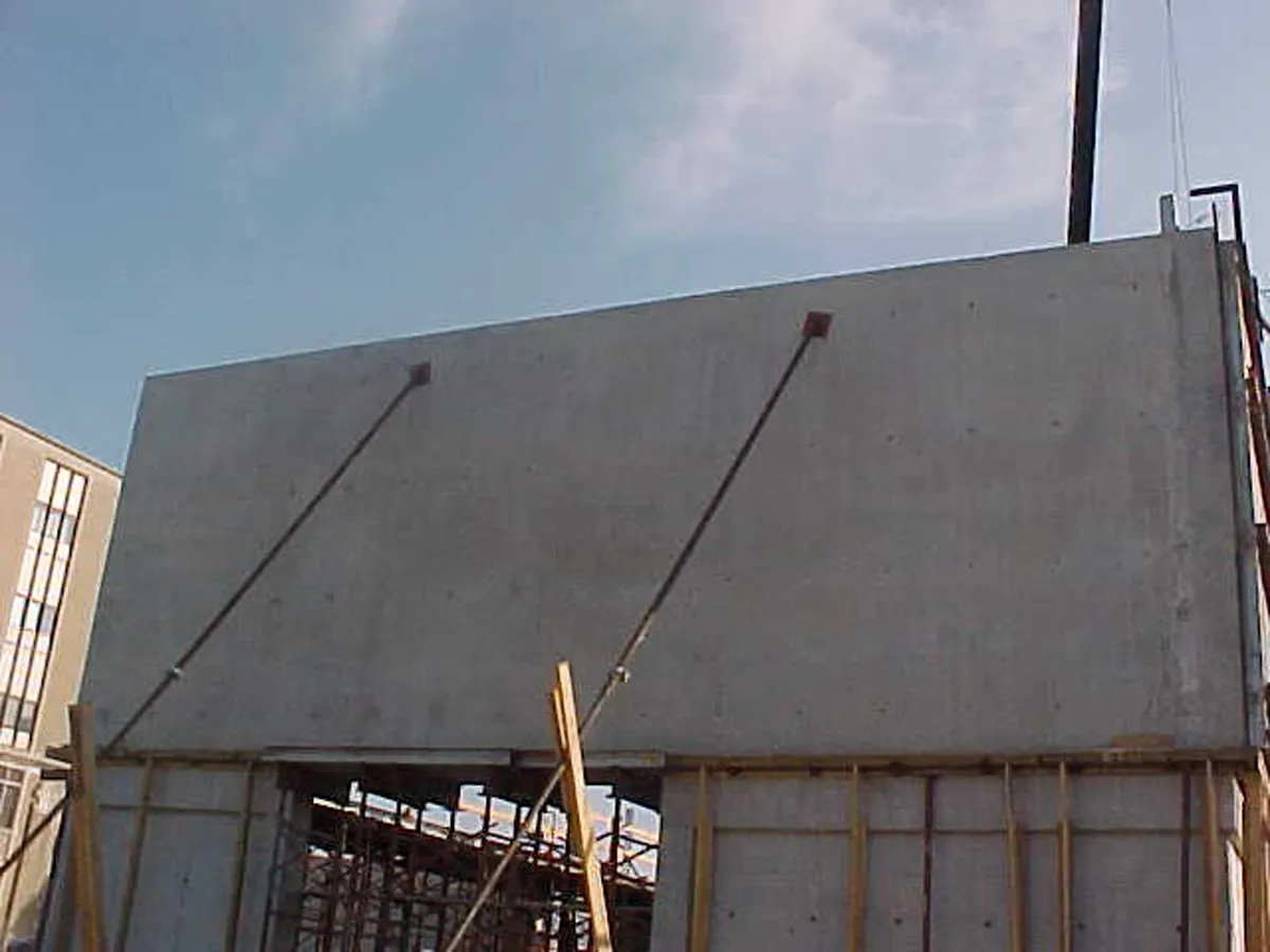Large precast or tilt-up concrete wall panels being staged at a job site