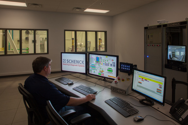 A technician seated at a control workstation at the MDA High Speed Balancing control room