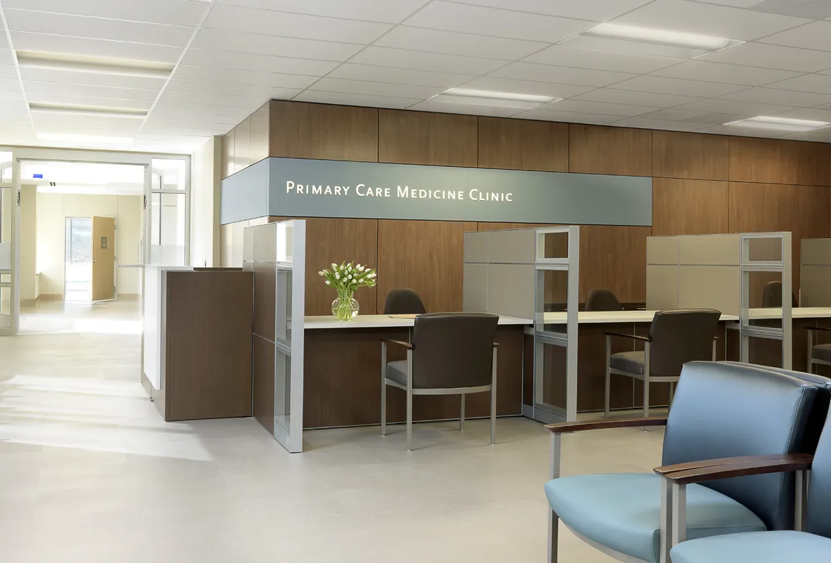 Open healthcare waiting area with soft seating and large windows