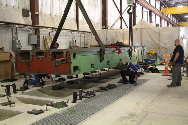 Aerial view of heavy machinery and green industrial equipment at a job site