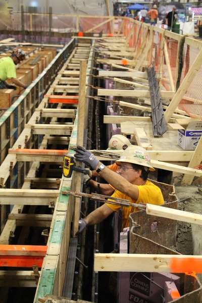 Workers installing rebar or steel reinforcement on a construction site