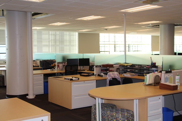 Finished office space showing workstations and open floor plan