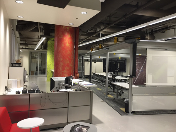 Interior view of a commercial space under renovation with drywall and open ceiling