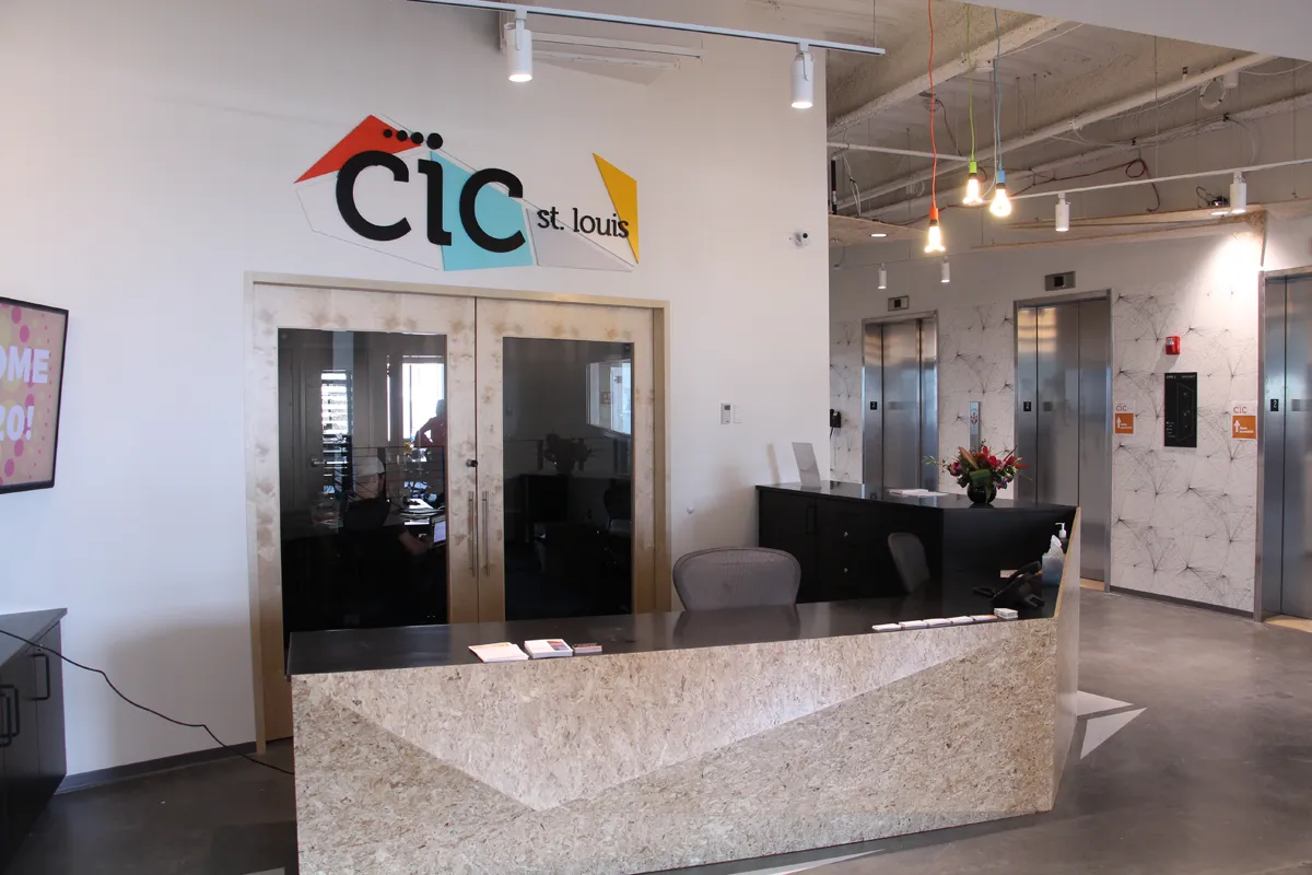 CIC branded reception or lobby entrance with white walls and modern signage