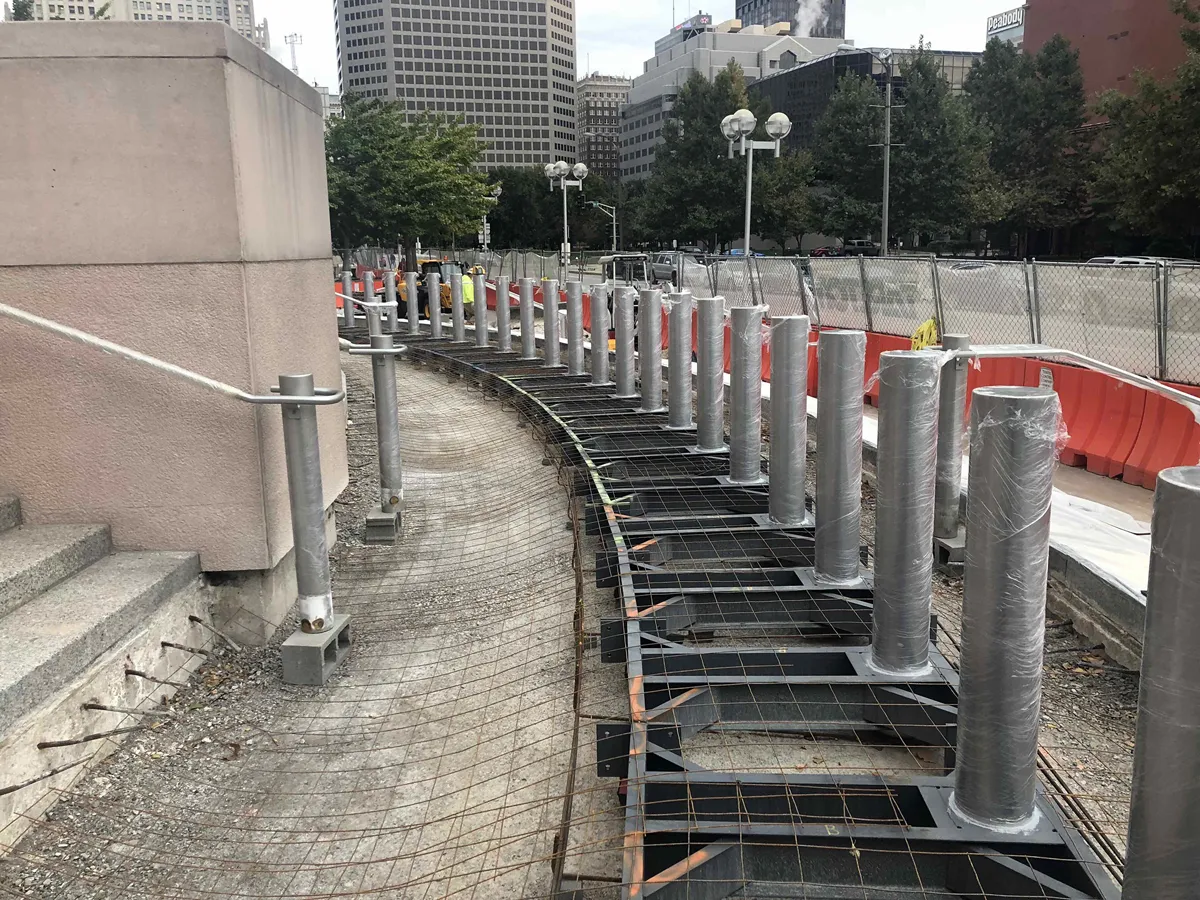 Curved concrete ramp or stairway structure at a parking or transit facility