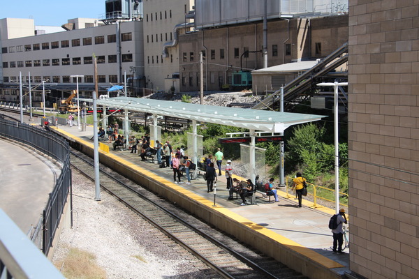 Pedestrian plaza train area with modern architecture and landscaping