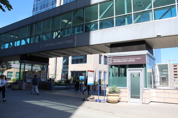 Exterior walkway and glass facade of a modern medical building