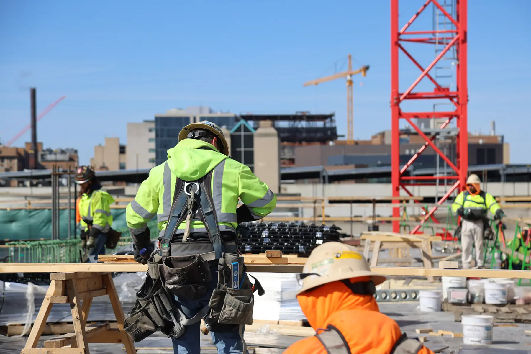 Construction workers on-site wearing safety equipment