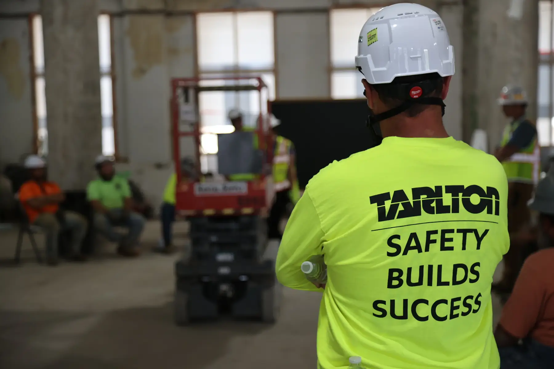 Tarlton employee in safety yellow shirt