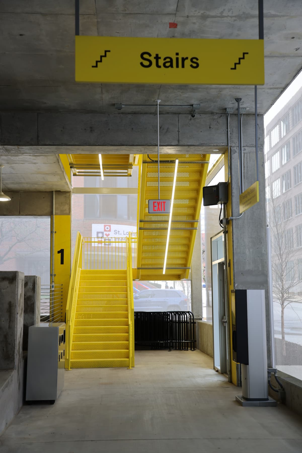 Bright yellow door and staircase inside a building under construction