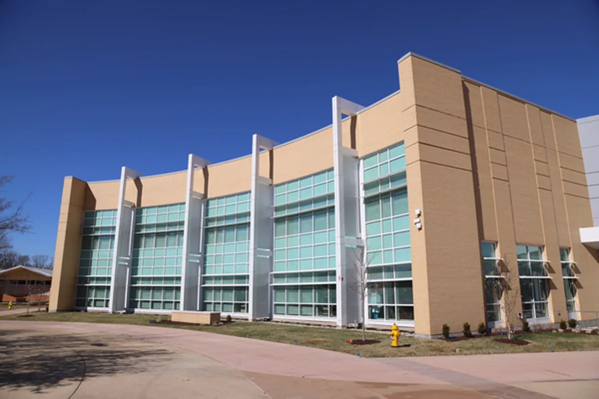 Exterior of a multi-story brick and glass academic or office building