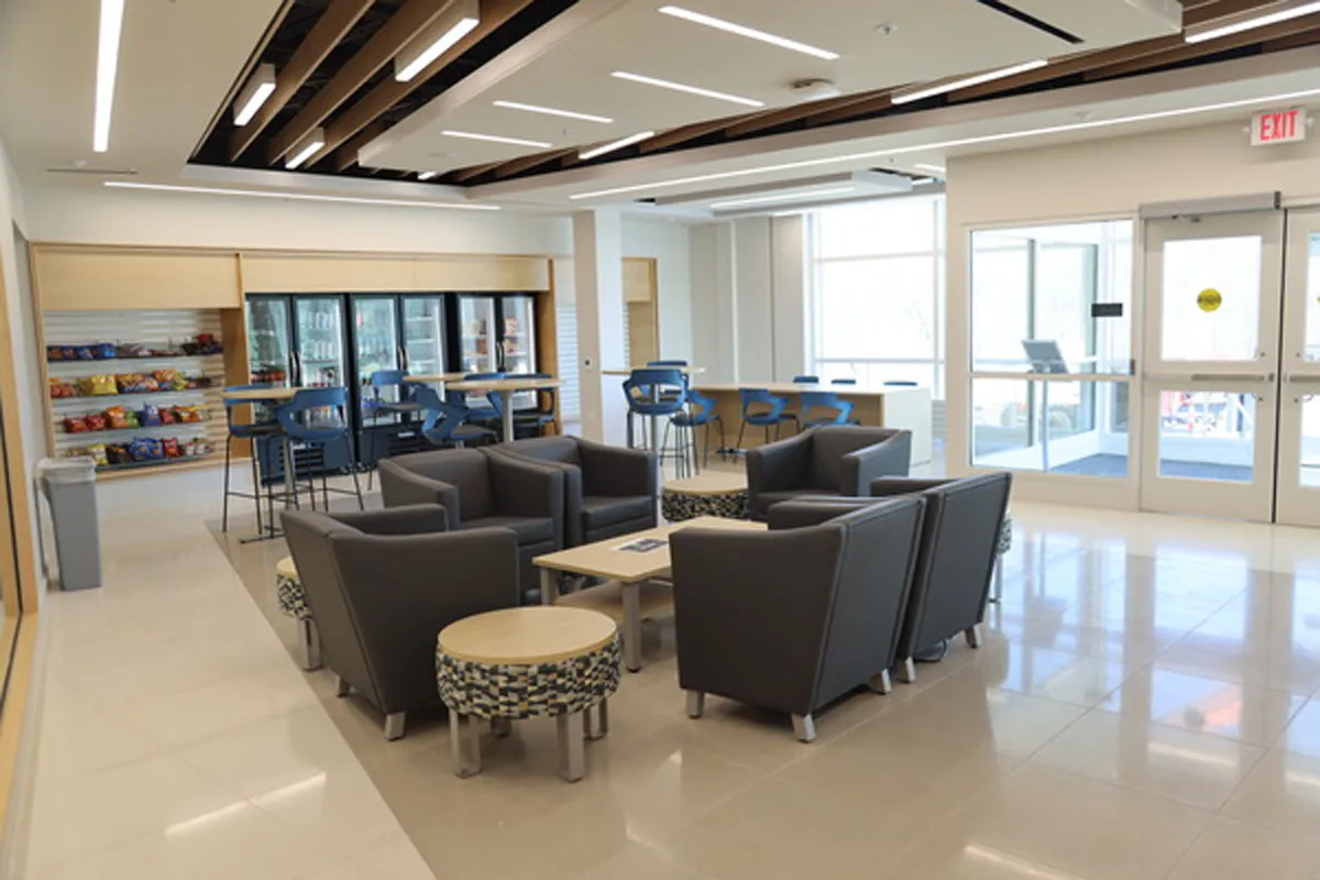 Modern lounge or waiting area with soft seating and large windows
