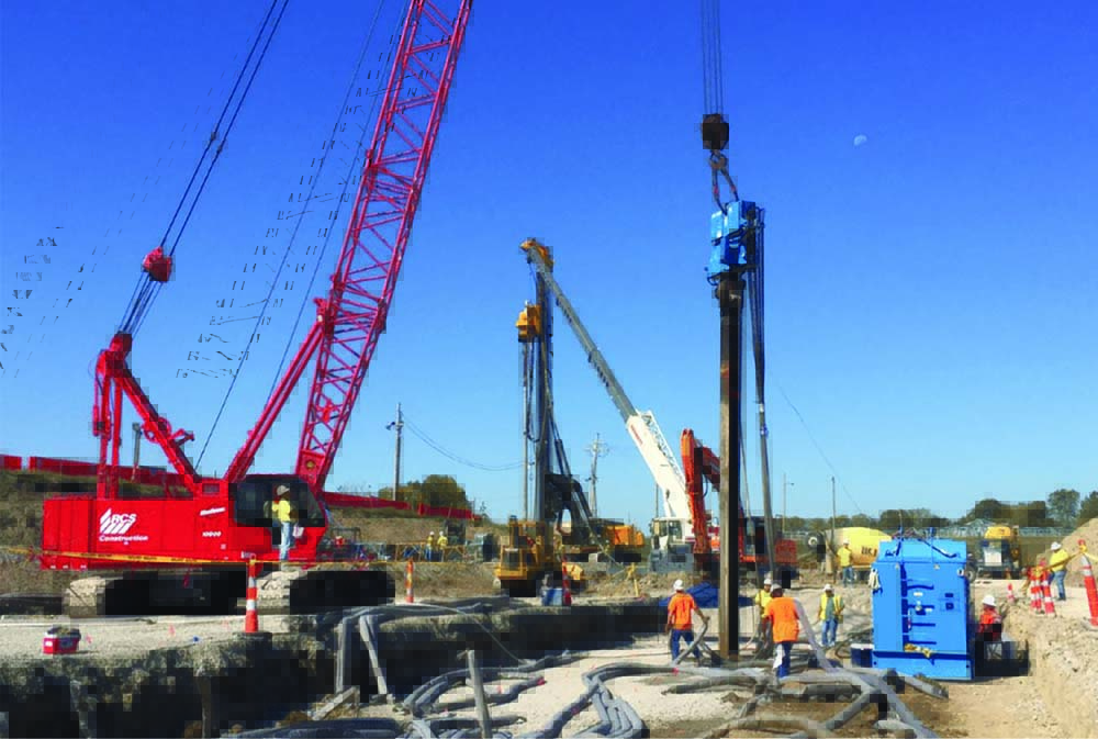 Red tower crane at an active urban construction site
