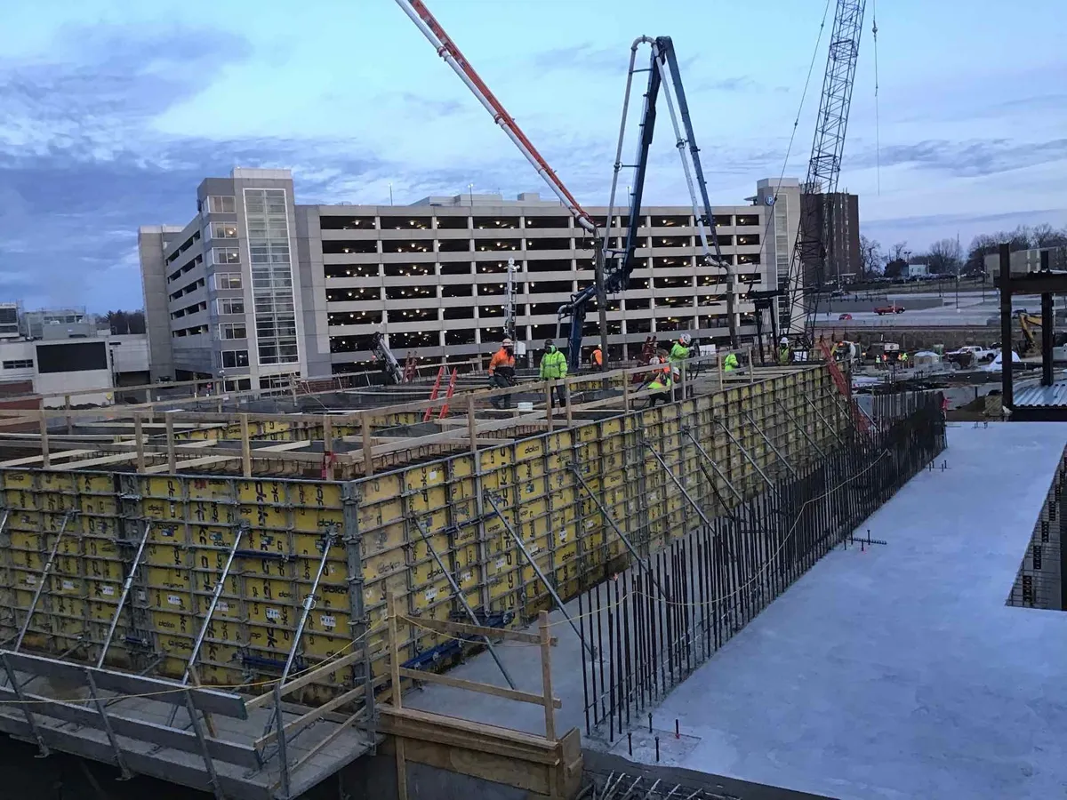 Concrete formwork and rebar installation at an early-stage construction site