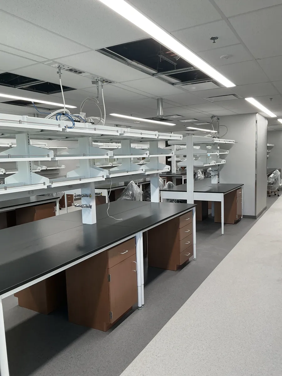 Clean laboratory or research space with black countertops and modern fixtures