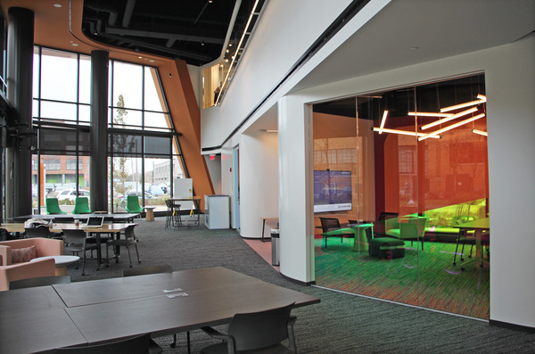 Open office or co-working space with wood ceiling accents and natural light