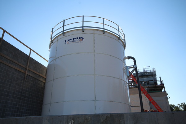 Large industrial water or storage tank at a construction or utility site