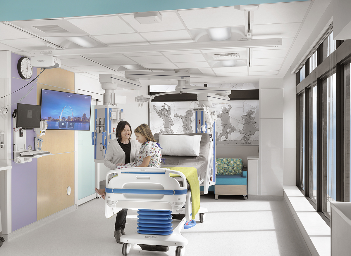 Modern patient room with medical equipment and large window
