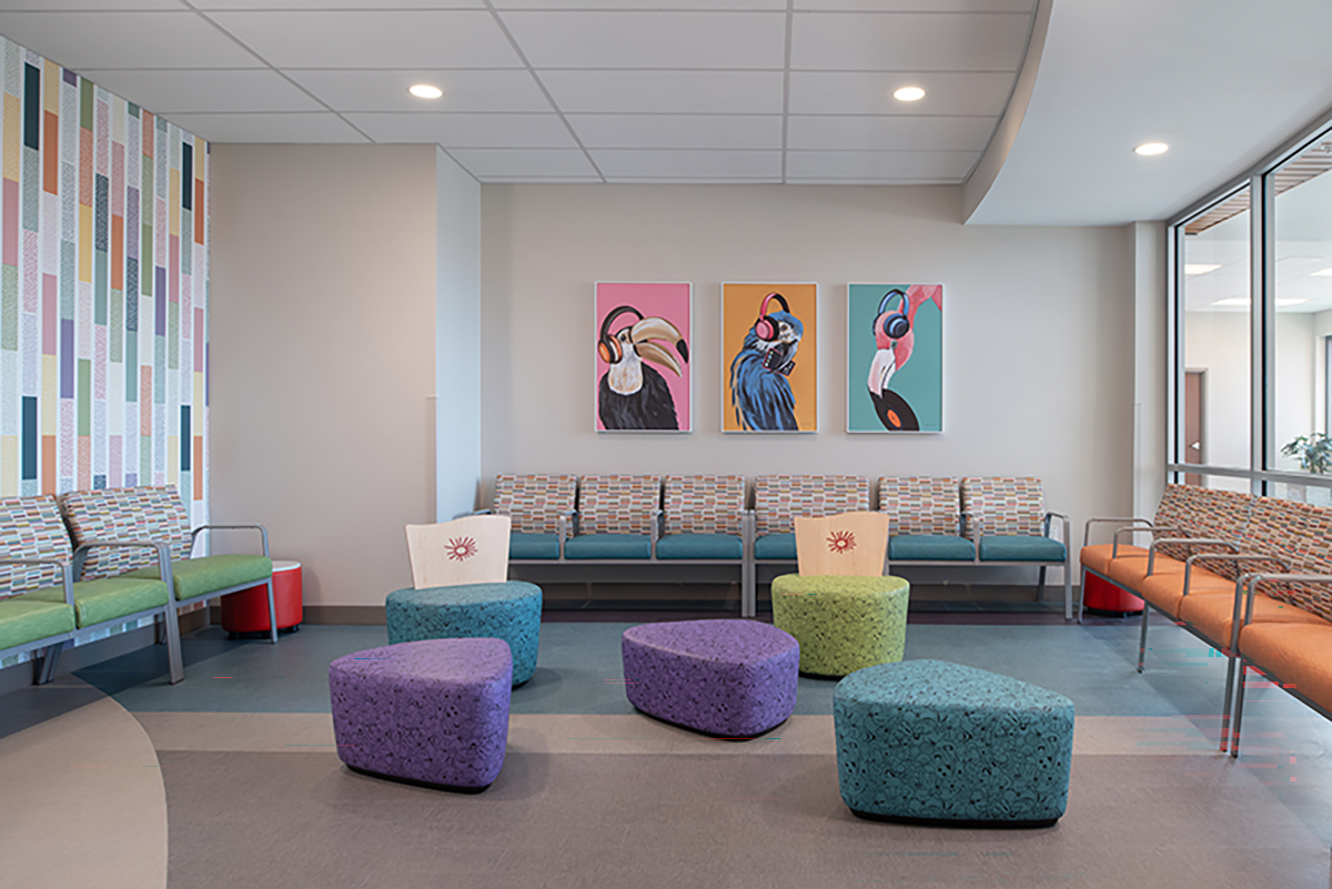 Modern healthcare waiting room with colorful seating and artwork