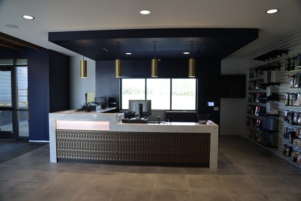 Modern reception or lobby area with white walls and neutral furnishings