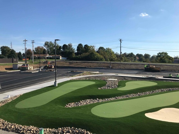 Aerial view of a landscaped outdoor putting green or recreational facility