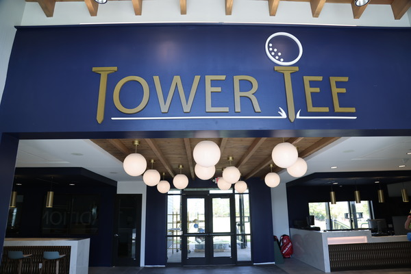 Tower Tee signage at the entrance of a commercial or entertainment venue