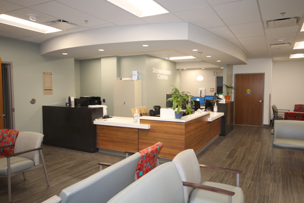 Reception desk in a modern lobby with recessed lighting